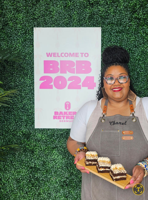 Chef Lotus showing off her Snickers Cake at the Bakers in Bermuda Retreat 2024. 