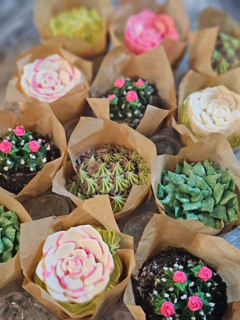 Succulent Cupcakes with various shades of pink and green 